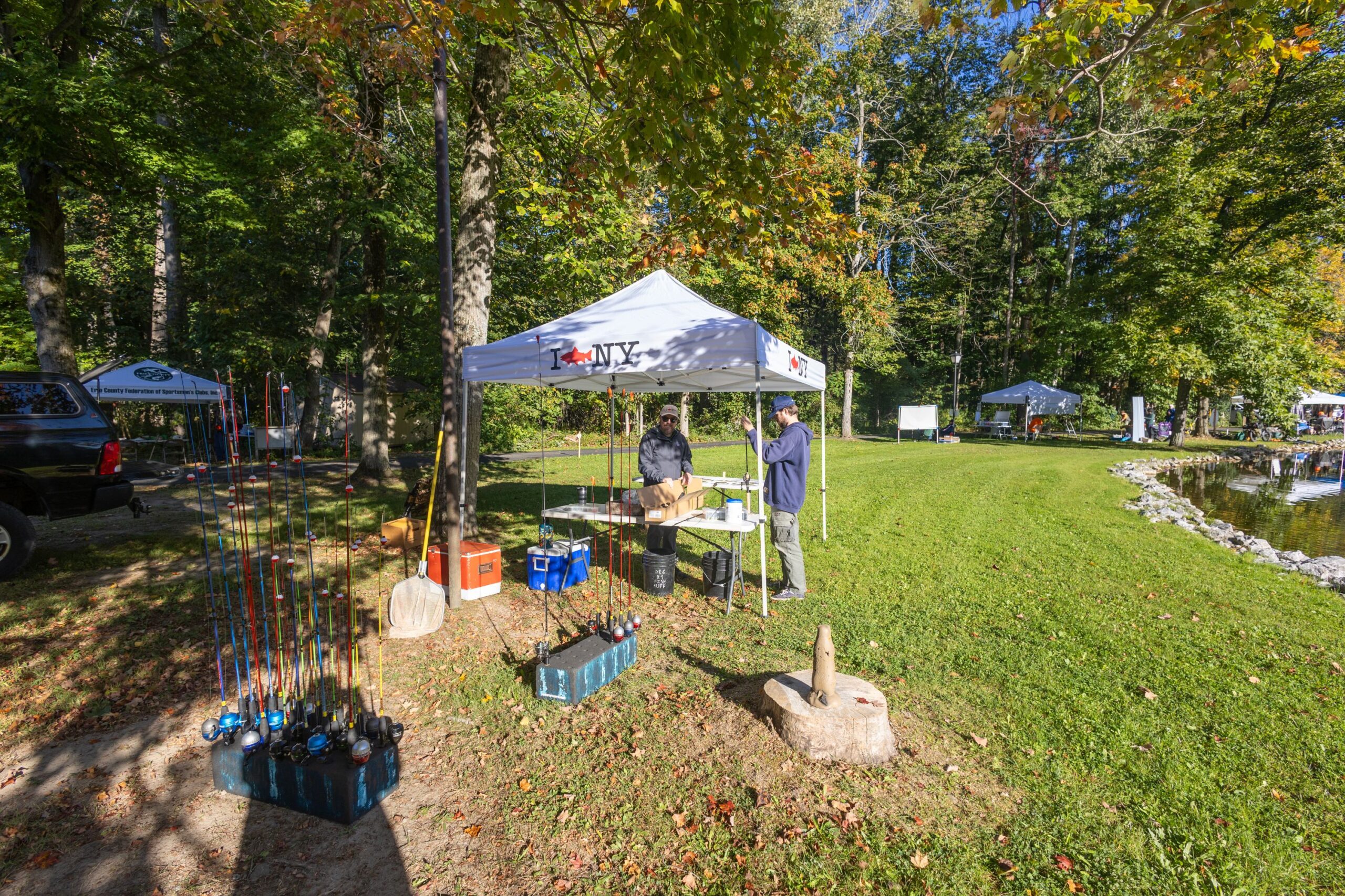 2026Sept26-022 NYSDEC Marine Biologist Mike Todd with helper for the live fishing display. Participants received a rigged fishing pole and worms to try their luck.