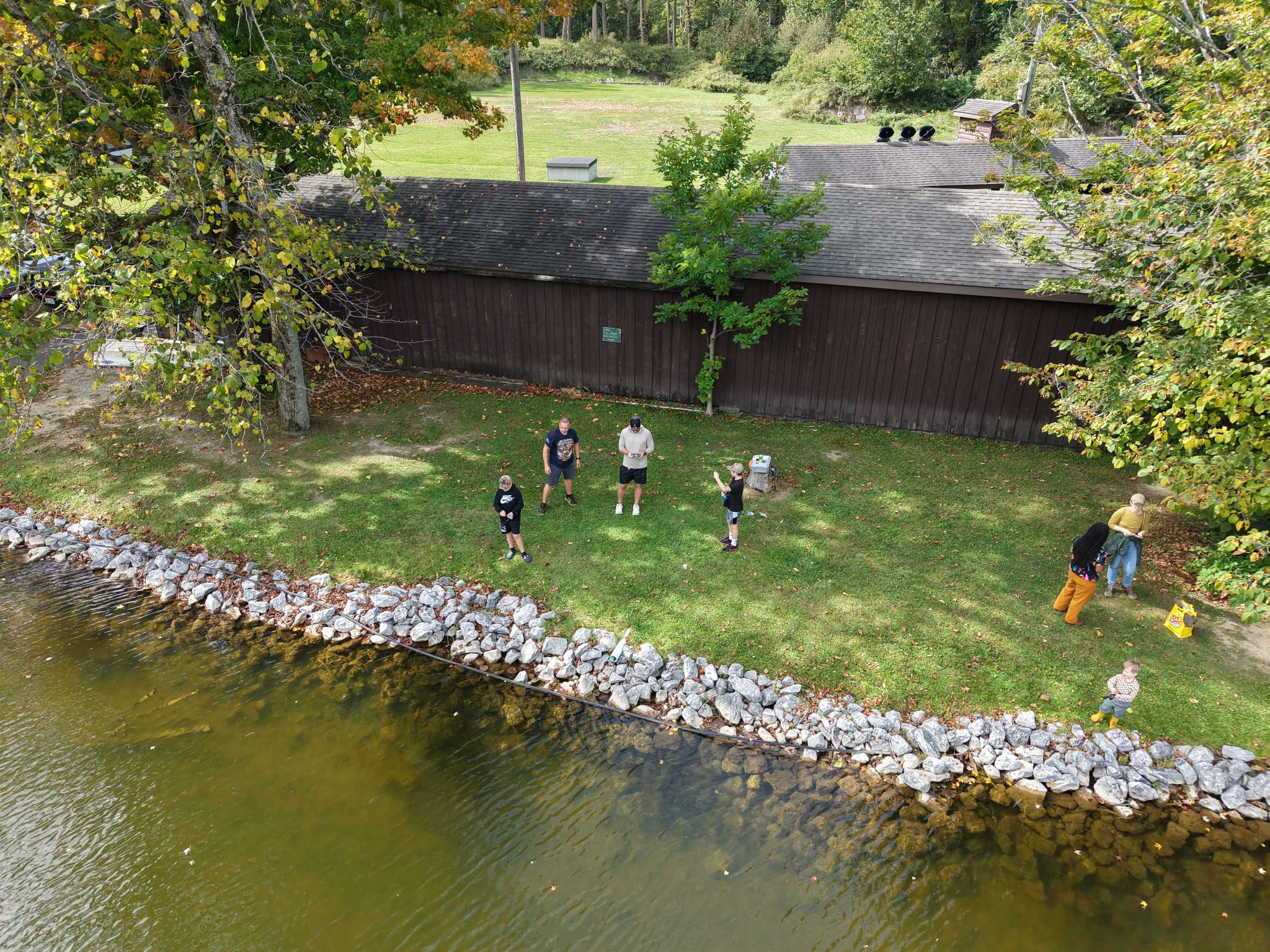 2026Sept26-210 Aerial view of the pond with kids fishing.